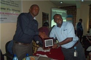 Engr. Rapheal Onoshakpor Presents the Award to the YP Chair Engr. Abdullateef Aliyu