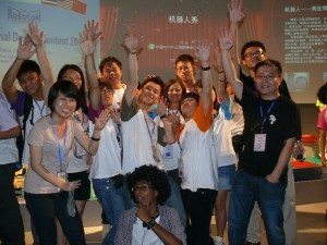 Jason Gu with students at Robocon