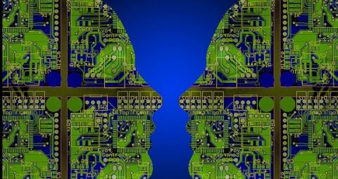 Image of two heads made from circuit boards facing each other