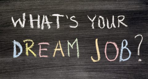 Stock photo with words What's Your Dream Job written in chalk on wood